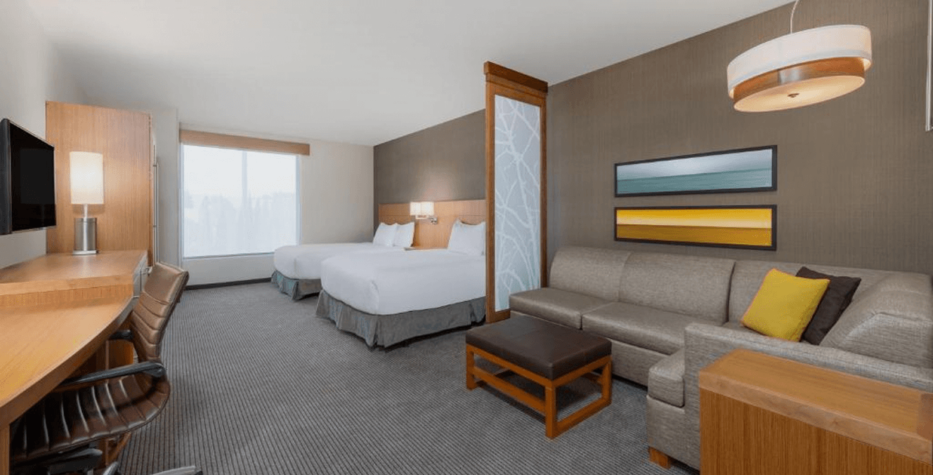 Furnished guest room at Hyatt Place San Jose Airport with two beds and contemporary casegoods